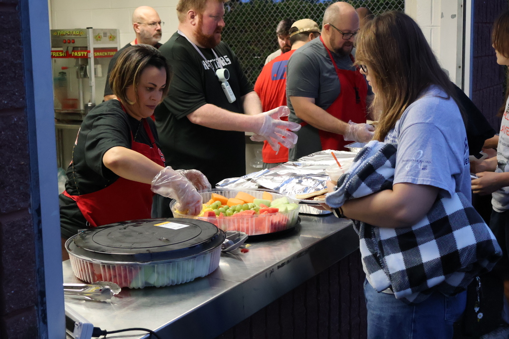 Teachers hand out refreshments