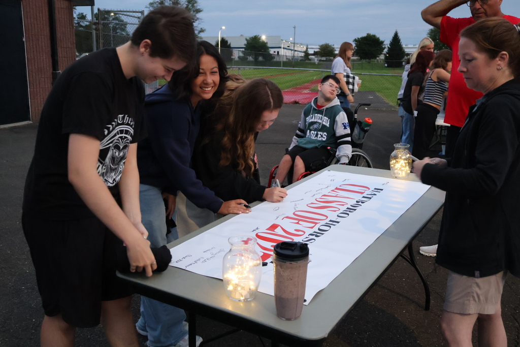 Students sign their Class of 2027 Banner