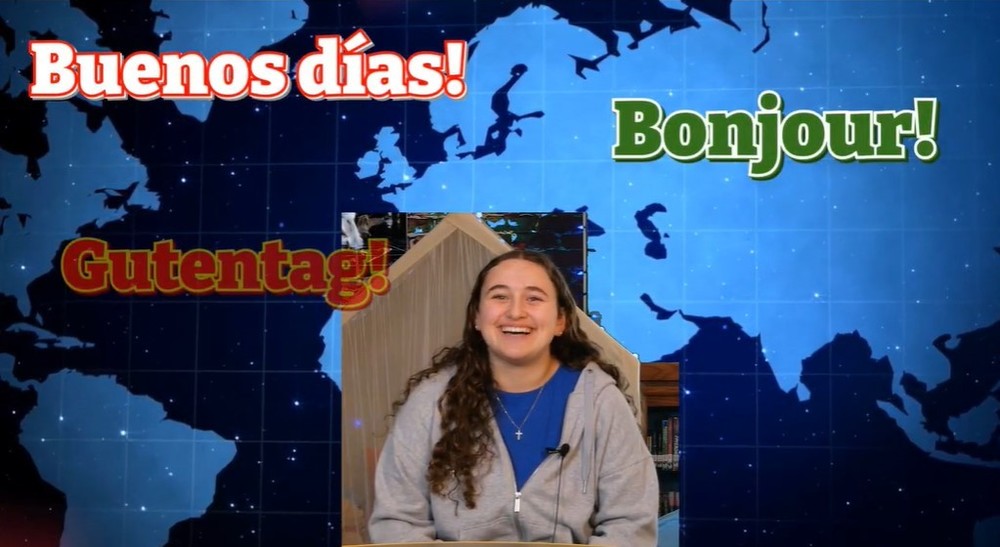 Student with Buenos Dias Bonjour and Gutentag text