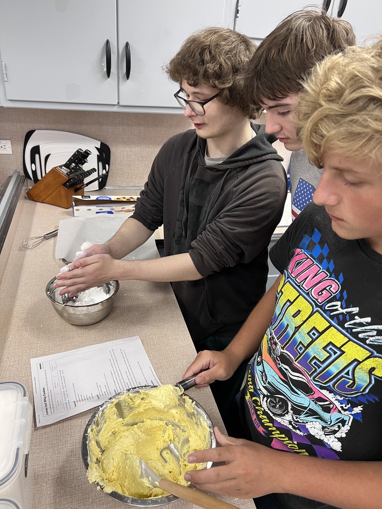 students mixing cookies