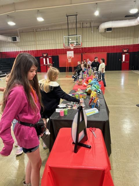 student spinning prize wheel
