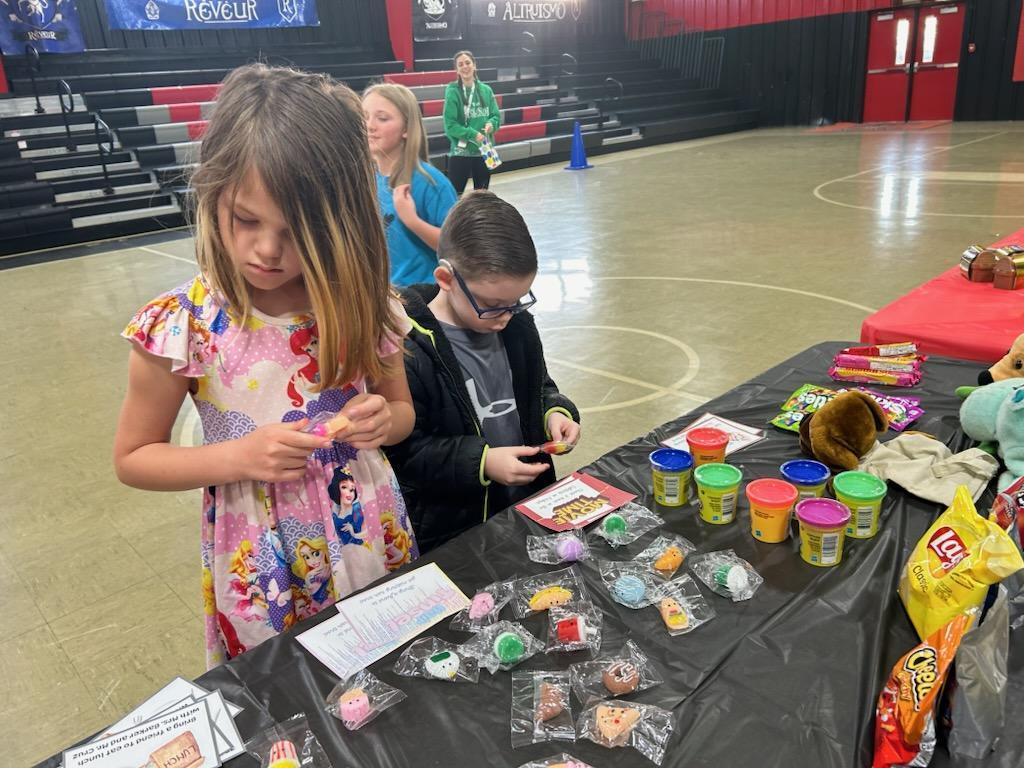 students at prize table