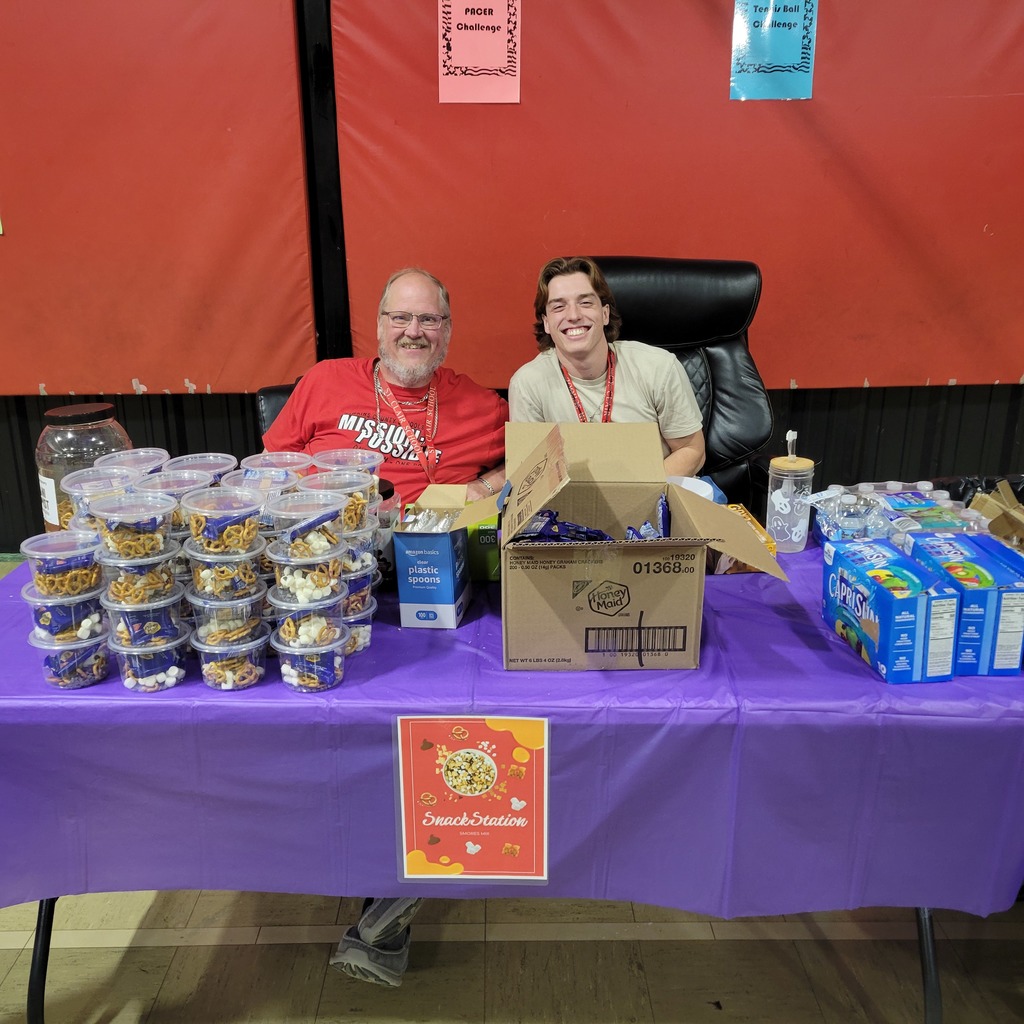 mr. Harris and coah Austin at a snack table