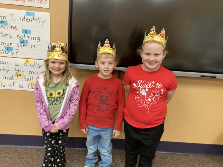1 girl and 2 boys wearing crowns