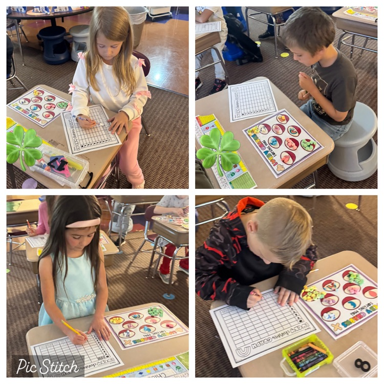 4 students sorting marshmallows at their desk. 
