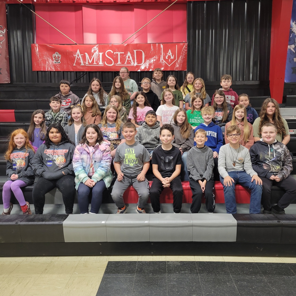 students sitting on bleachers 