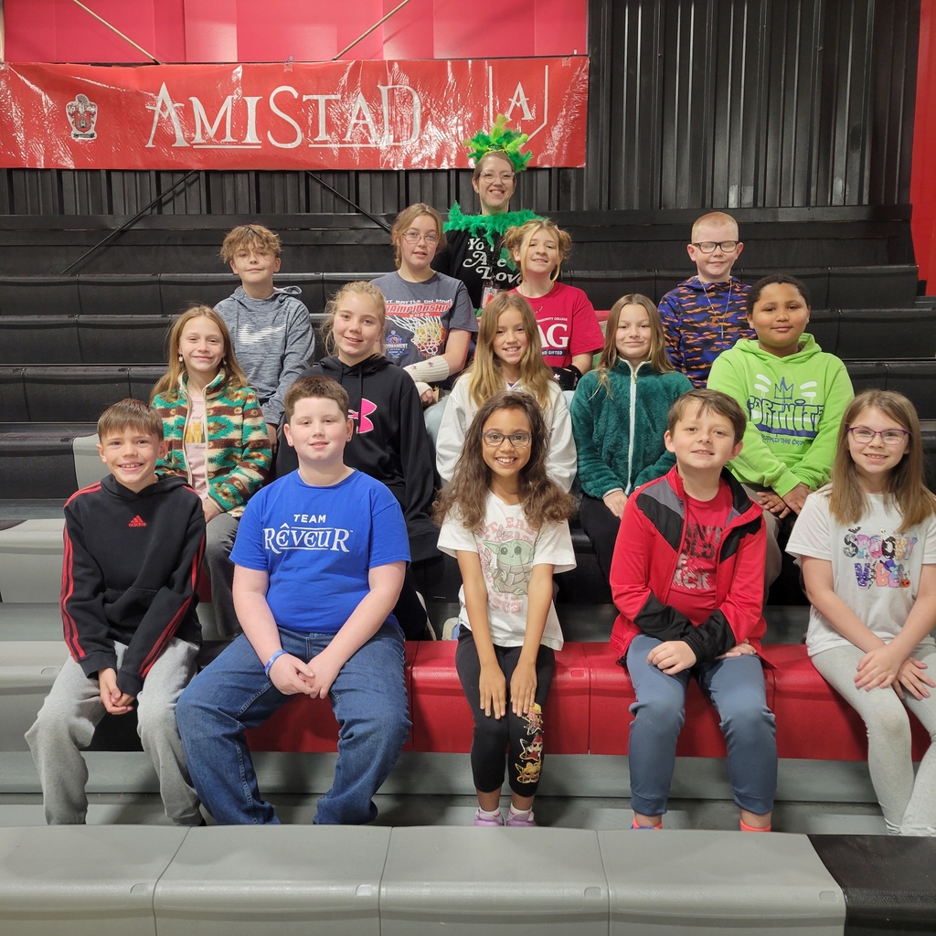 students sitting on bleachers 