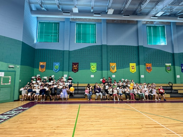 a groups of students on bleachers