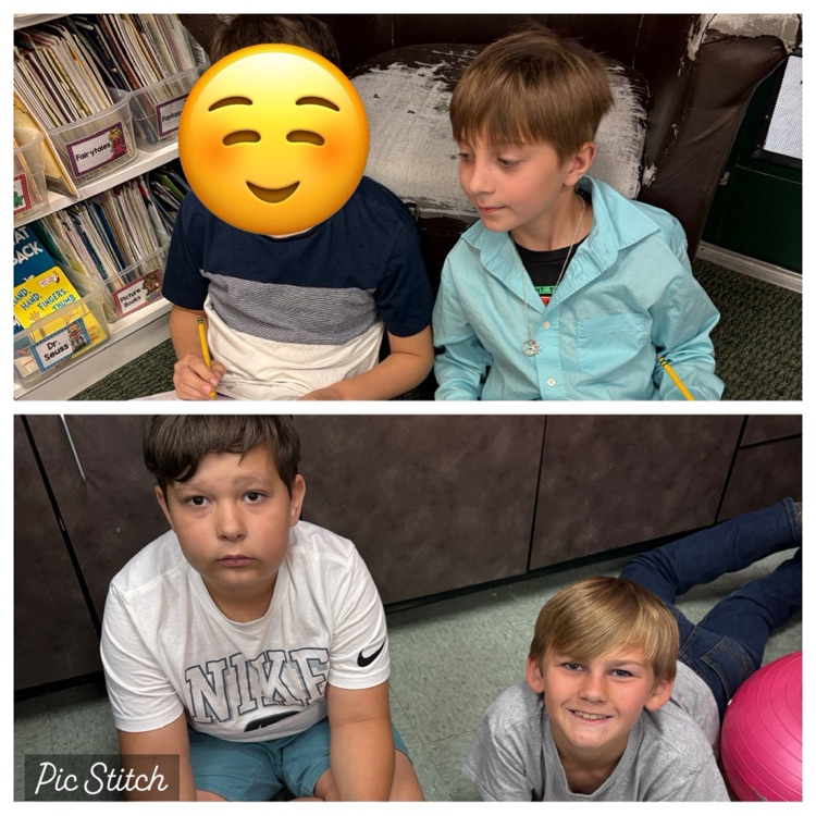 4 students sitting on the carpet
