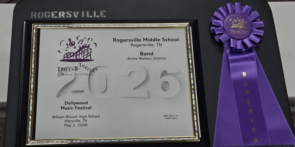 A framed award certificate for the 2025 Dollywood Music Festival sits next to a purple ribbon saying "Superior."