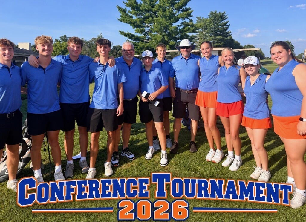 Group of people in blue and orange attire stand on a green field, posing for a picture. The words "Conference Tournament 2026" are displayed.