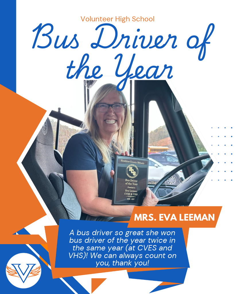 Woman smiling, holding plaque, seated in bus driver's seat, wearing glasses, blue shirt. Text reads "Bus Driver of the Year".