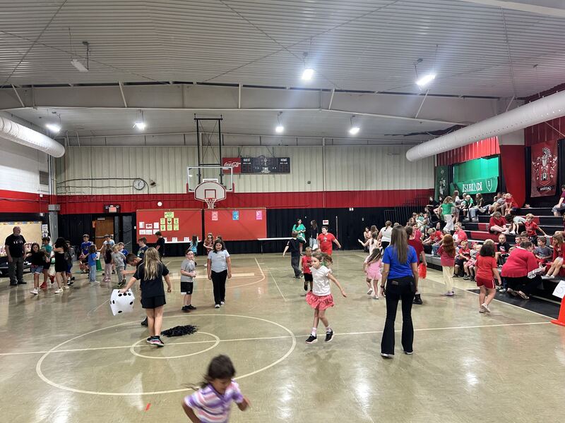 Students playing in a gym.
