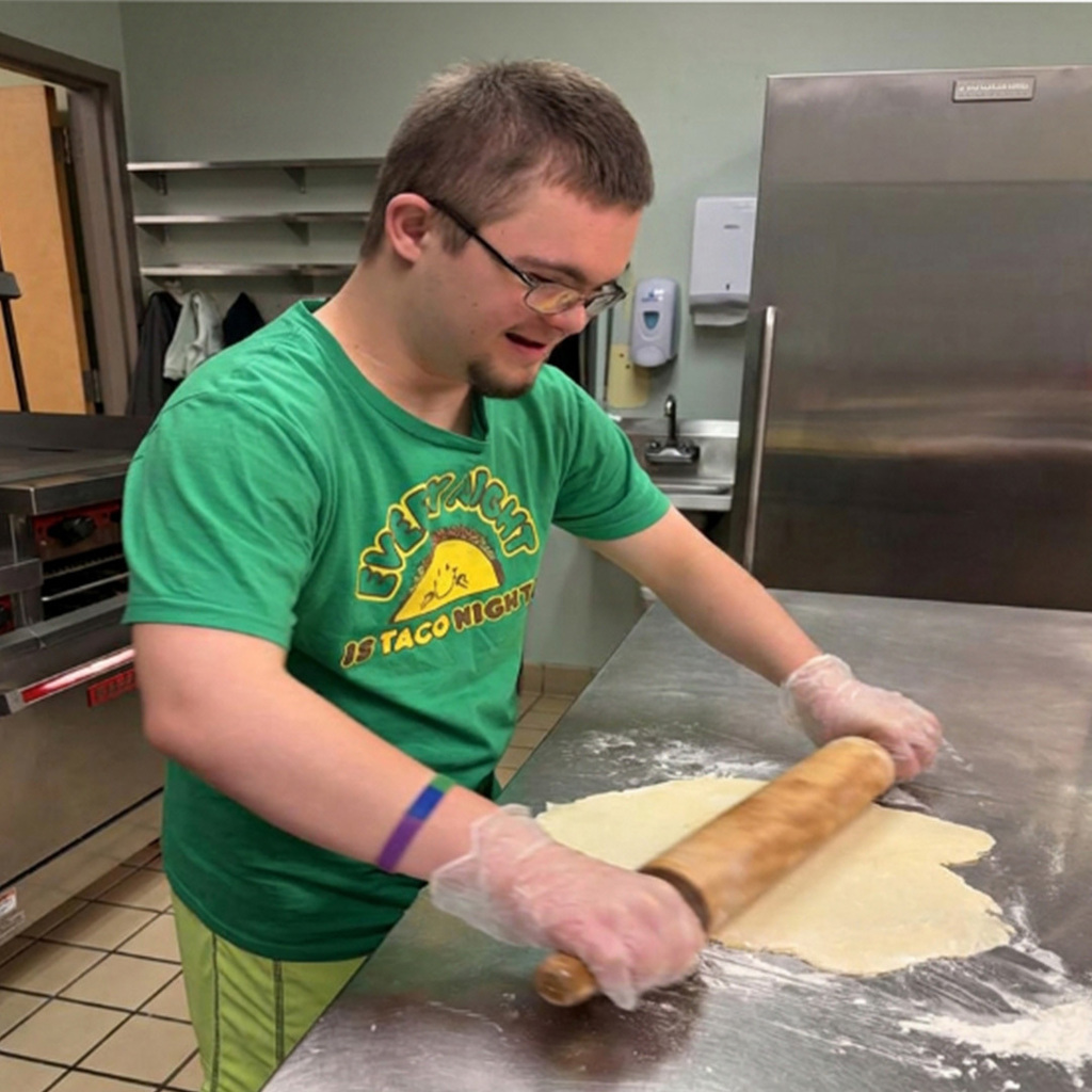 Student rolling out pastry