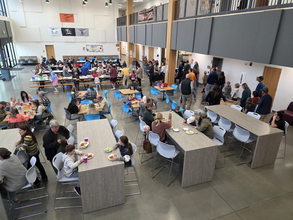 Families enjoying the Spaghetti Dinner in the commons