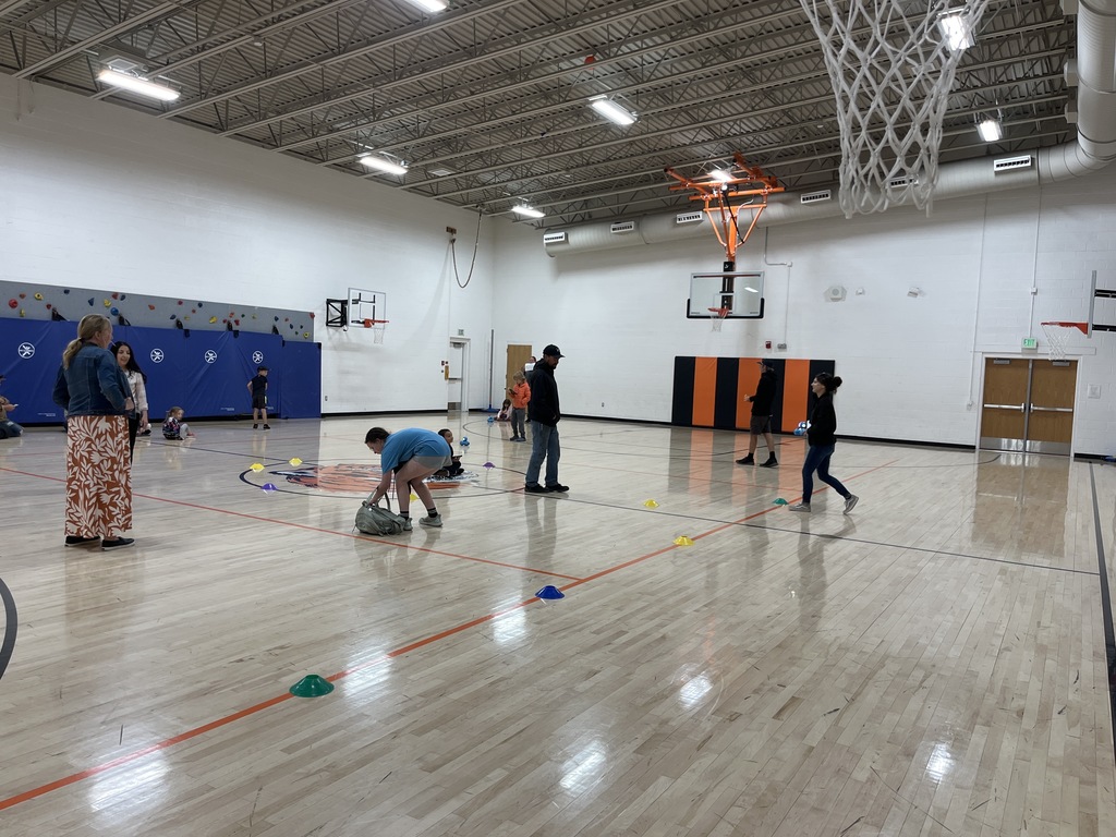 Kids in the gym enjoying a STEAM activity