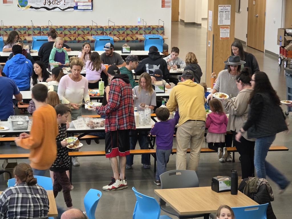 Families enjoying the Spaghetti Dinner in the commons