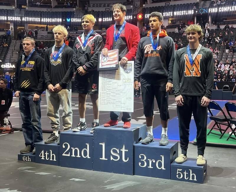 Carson Campbell at State Wrestling on Podium for 5th Place