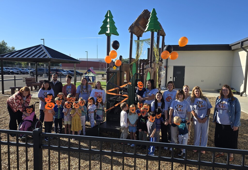 Preschool Students and Teachers in front of the new playground