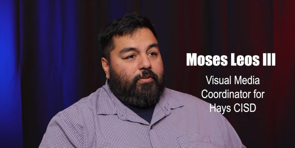 Moses Leos the third, Visual Media Coordinator for Hays CISD. A man with short hair and a beard in a patterned shirt. 
