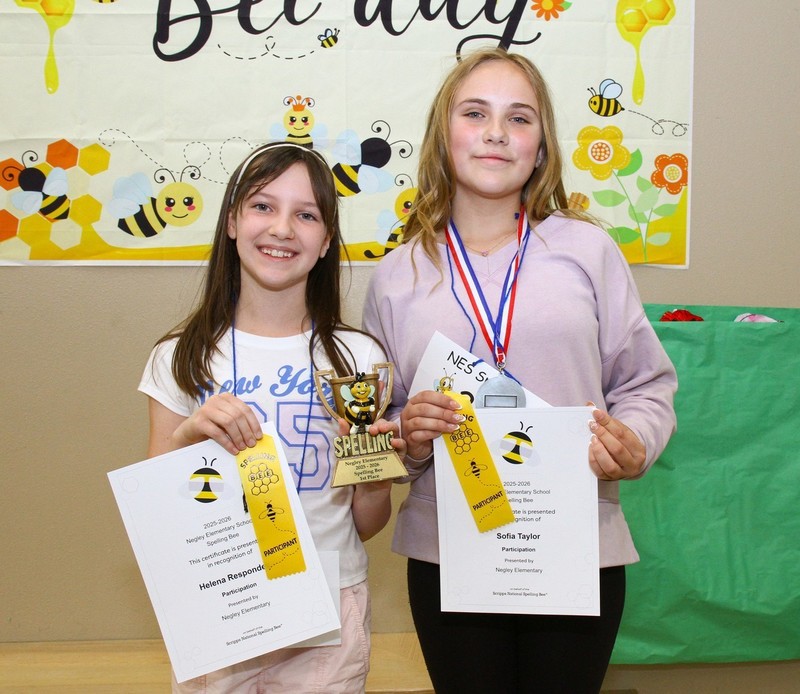 Two NES students who won first and second place in their campus spelling bee.