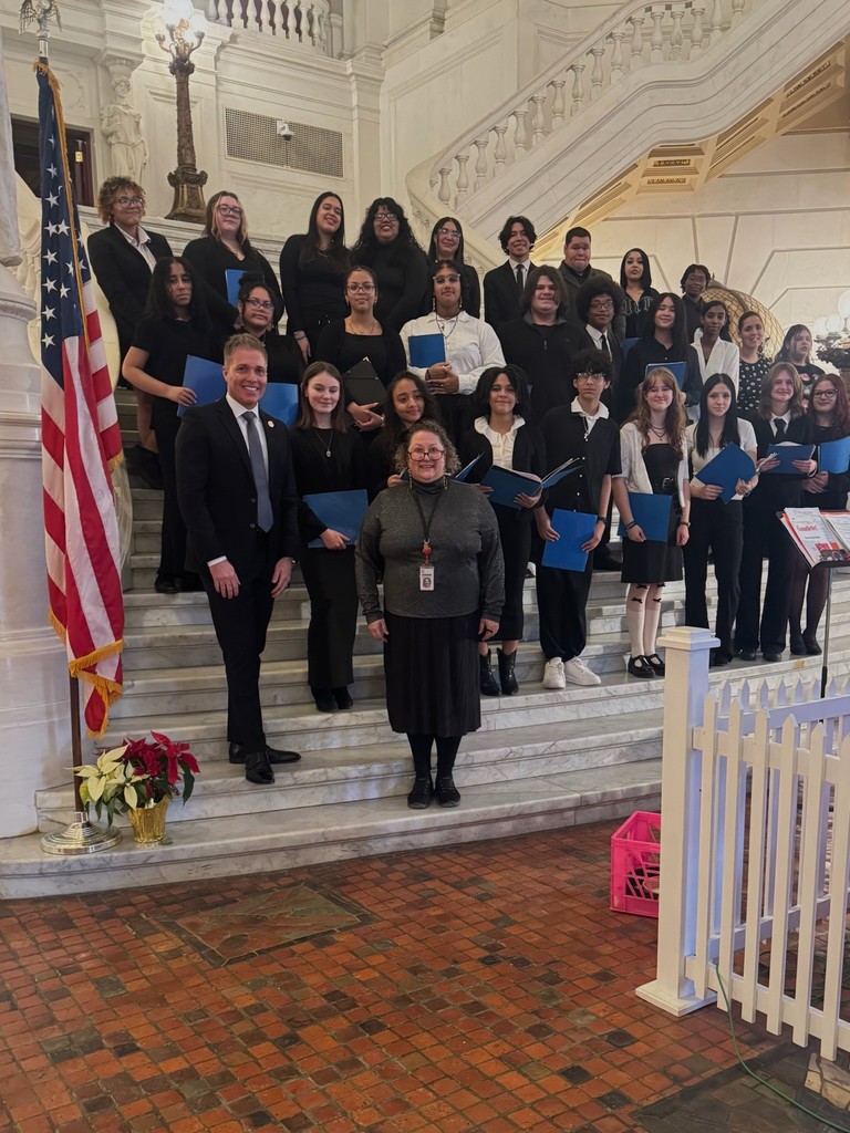 Representative Dane Watro standing for a picture with the Hazleton area chorus members 