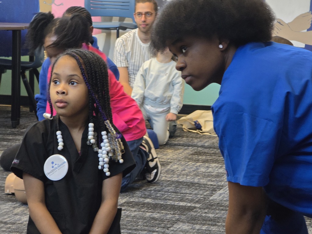 A kid with a senior paying attention