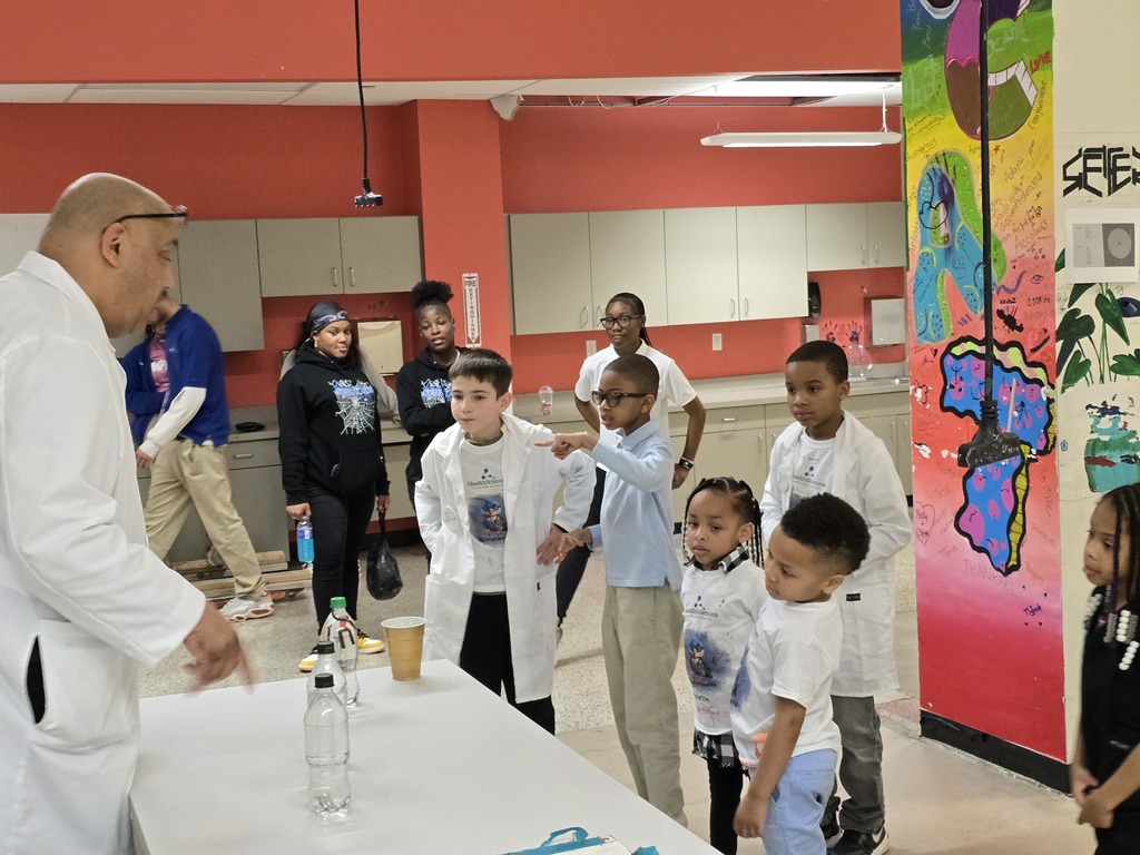 Kids getting a science lesson from Mr. Baxter