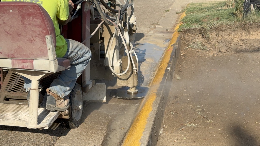 Curb is cut out at TMP-Marian near the CLB on Aug. 4, 2025