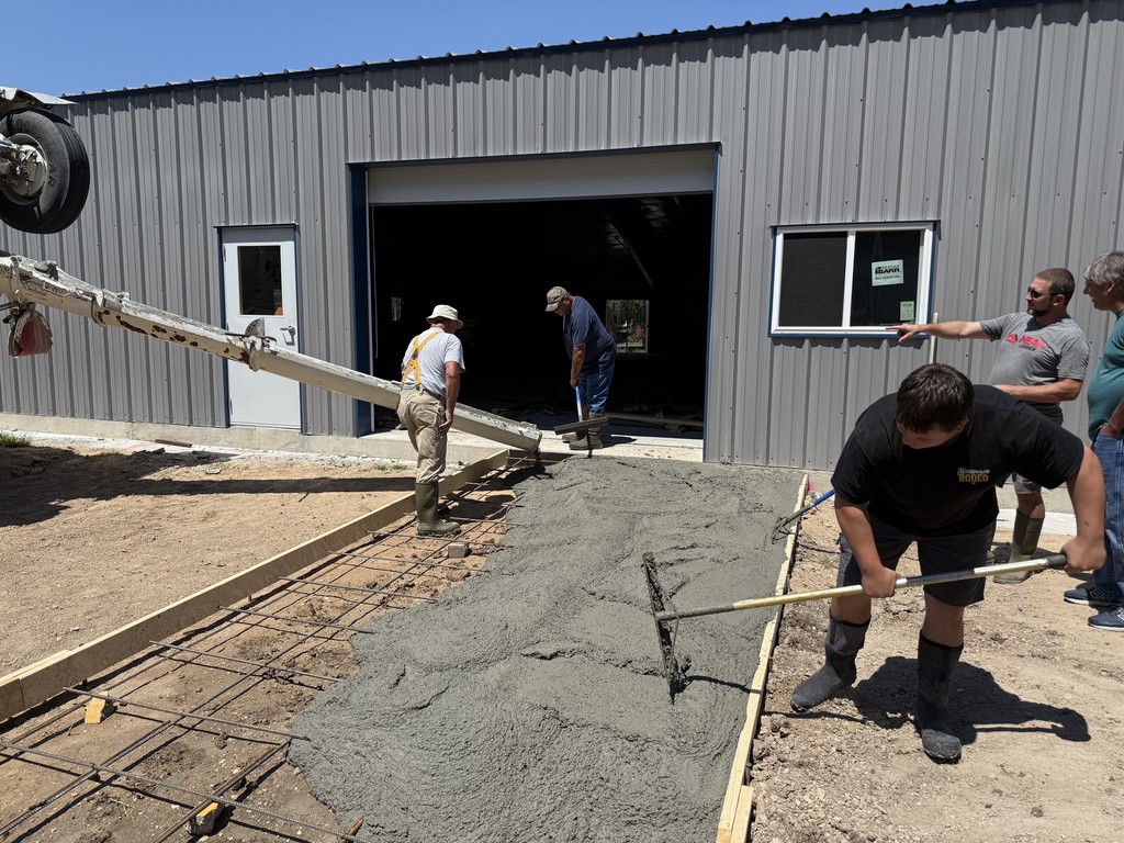 Volunteers pour part of the concrete driveway to the CLB