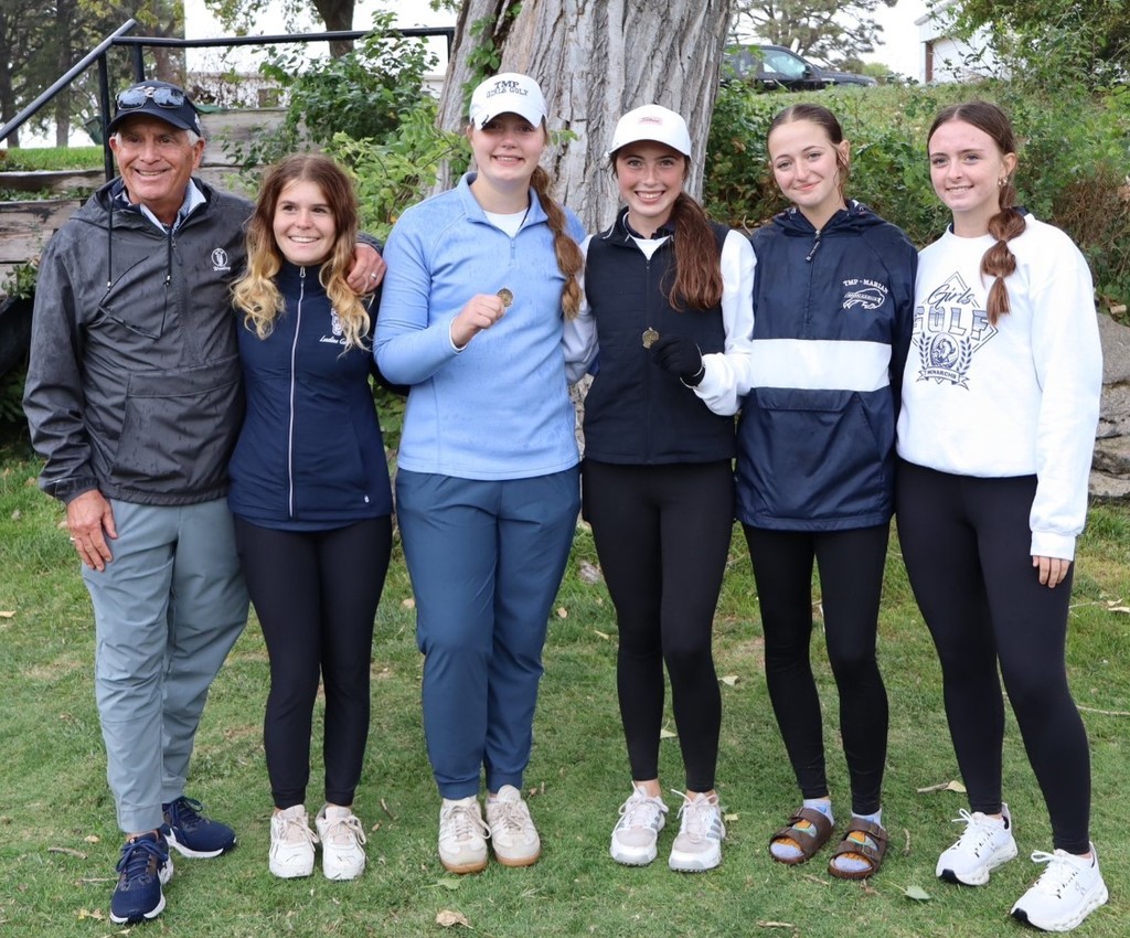 girls golf team with coach