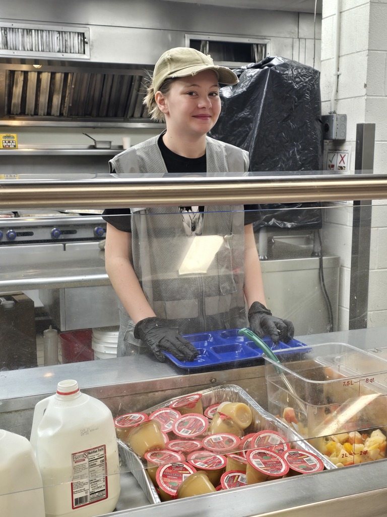 Student serving at Samaritan House