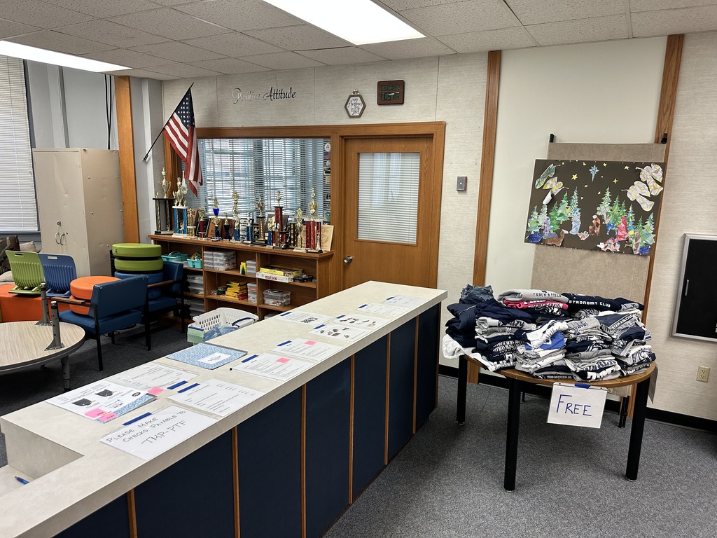 Free TMP-M t-shirts for spirit dress and PE on a table