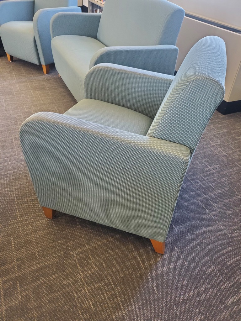 turquoise colored waiting chair with armrests