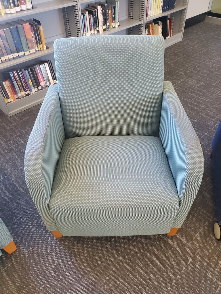 turquoise colored waiting chair with armrests