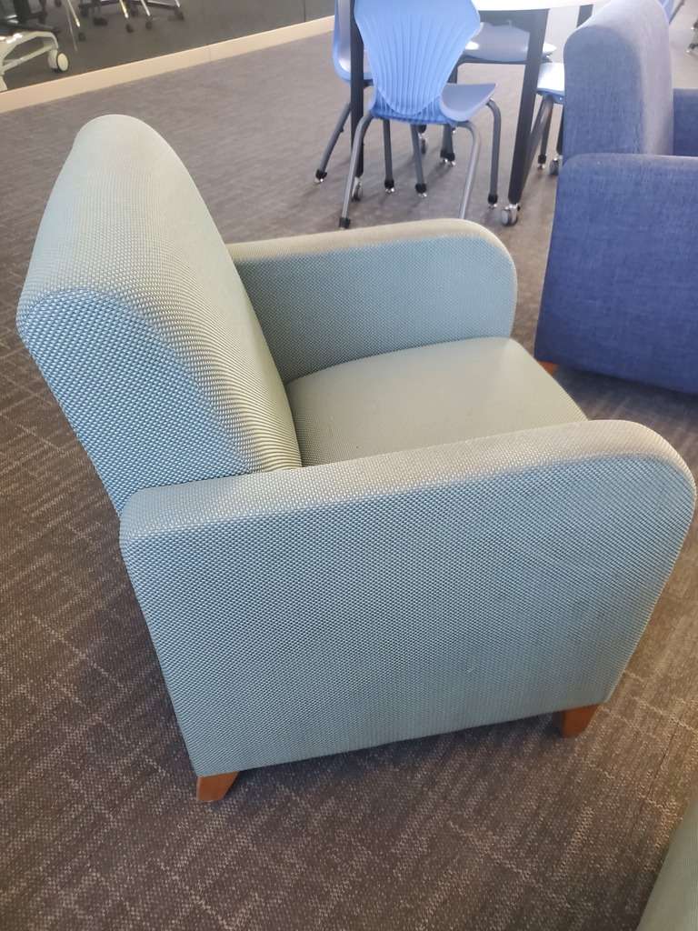 turquoise colored waiting chair with armrests