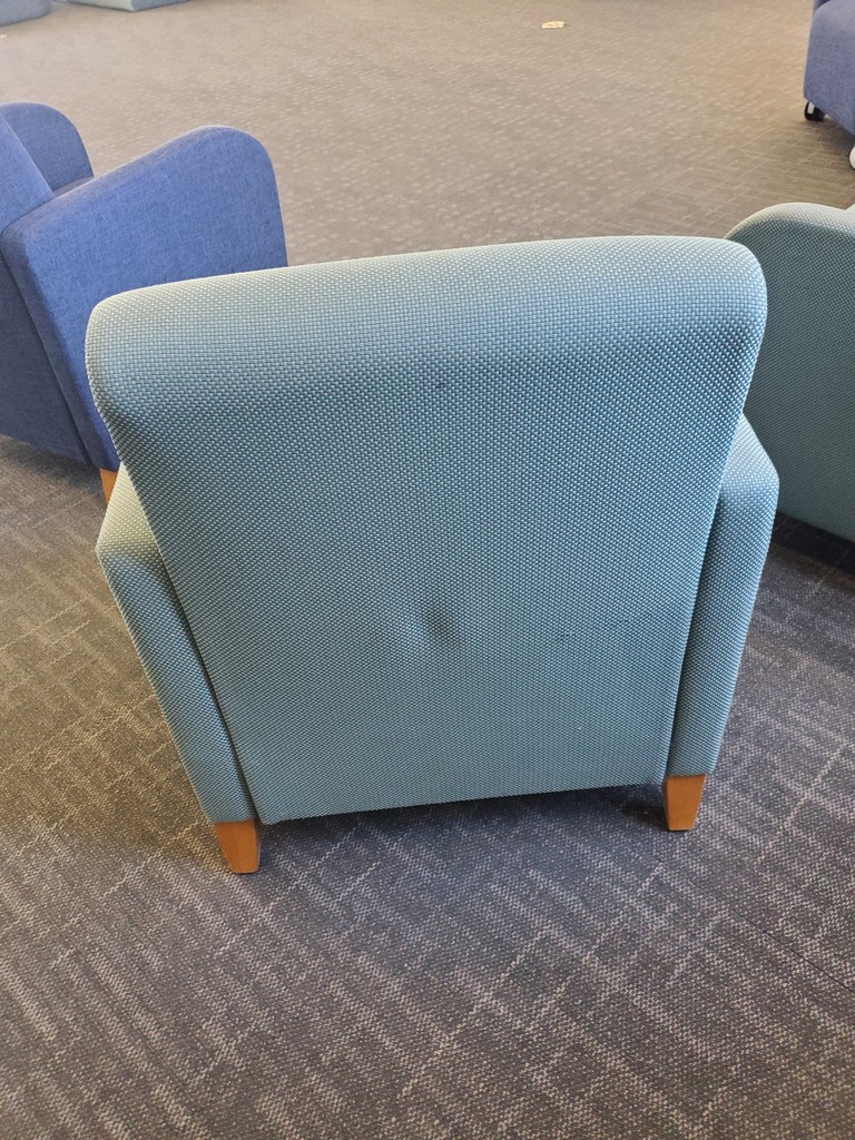 turquoise colored waiting chair with armrests