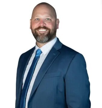 Superintendent Geoff Andrews portrait in blue suit