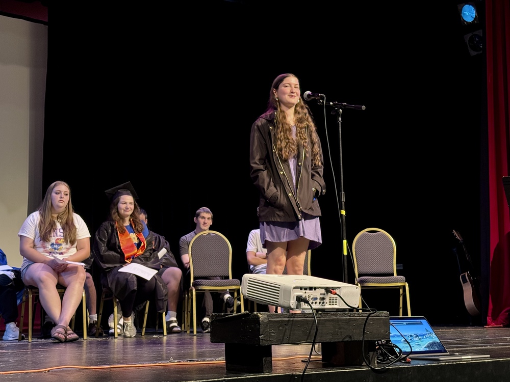 Avital Krebs speaks on Smith Jewish Academy stage at Senior Walk program