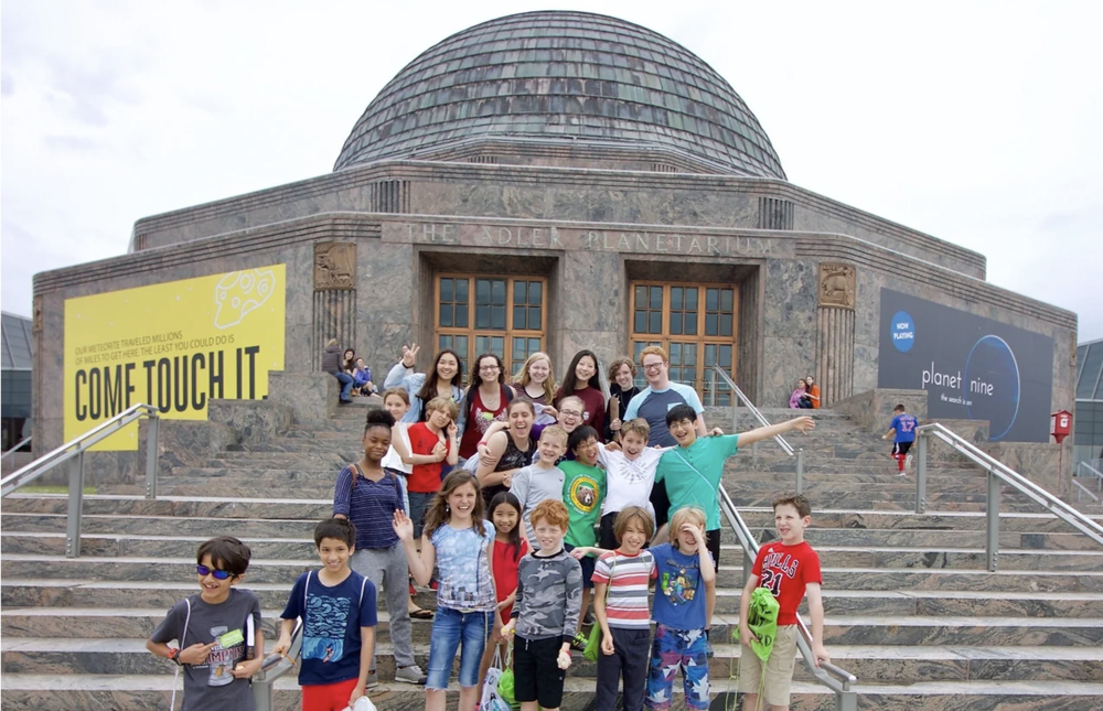 Leah and students on steps of Adler Planetarium