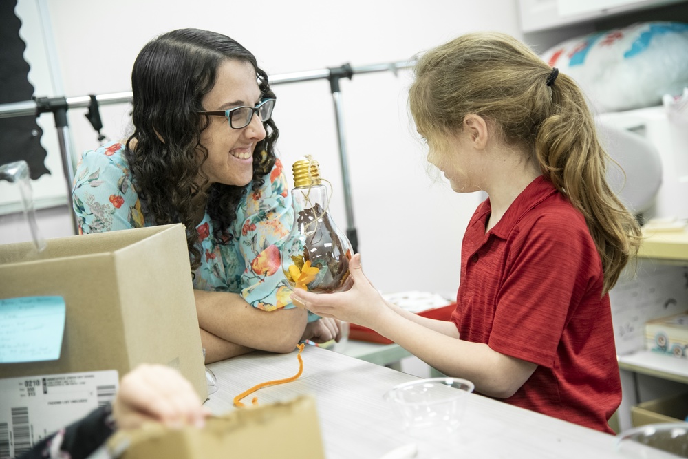 Rivka with student in Makerspace
