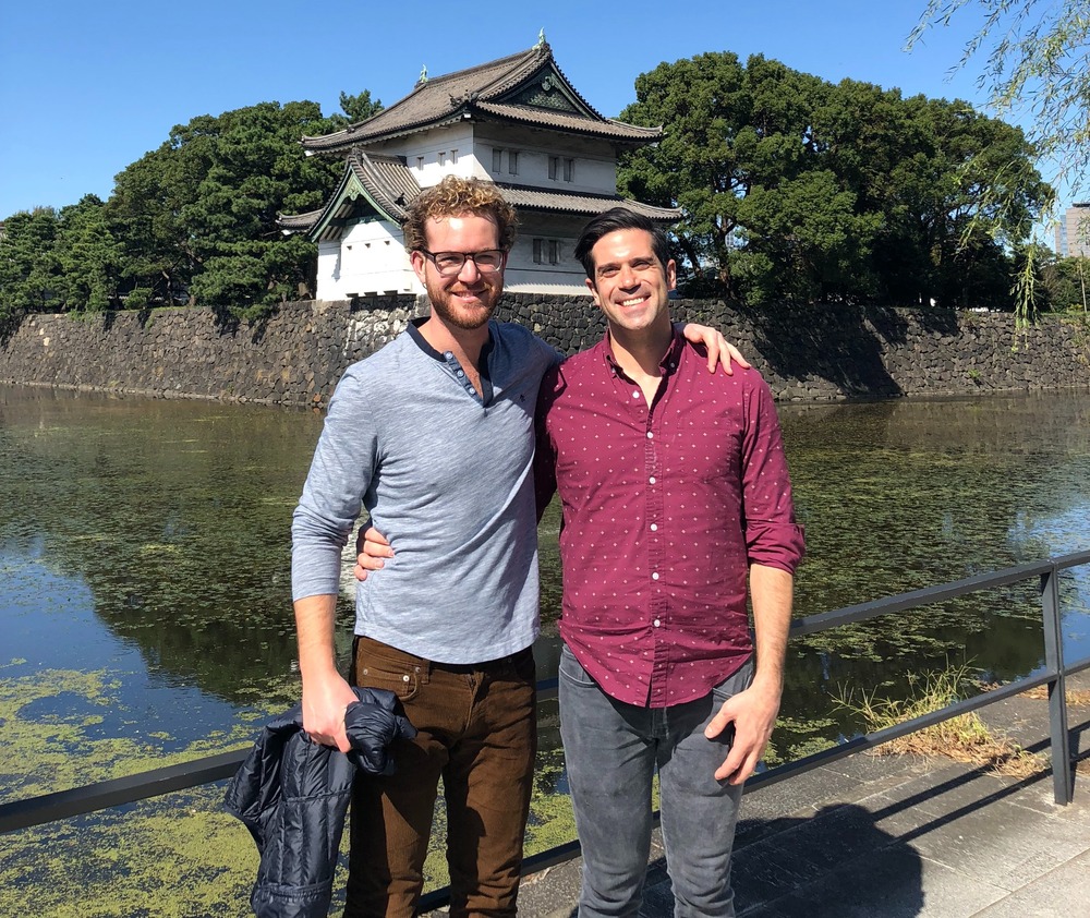 Nathan Meyer (right) with husband Tucker in front of pond in Japan