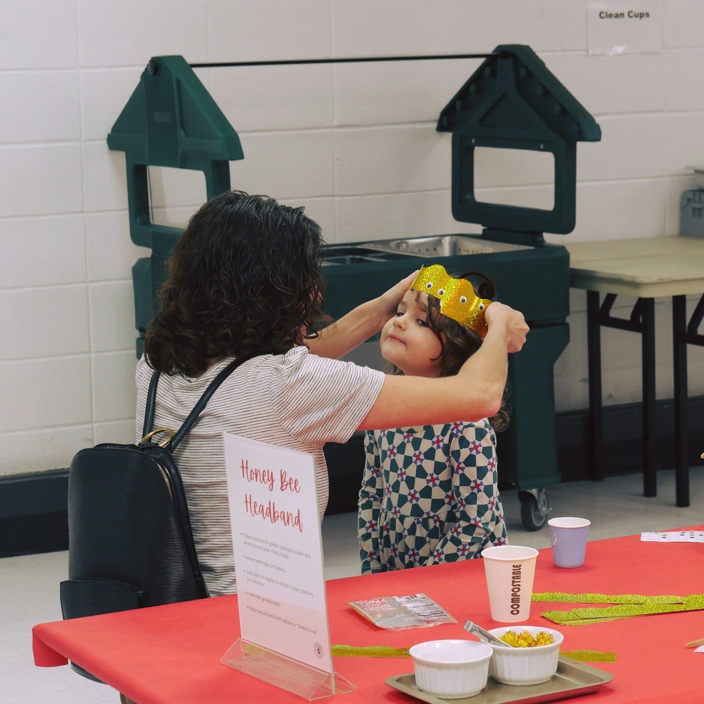 Mother putting a cardboard crown on her kid