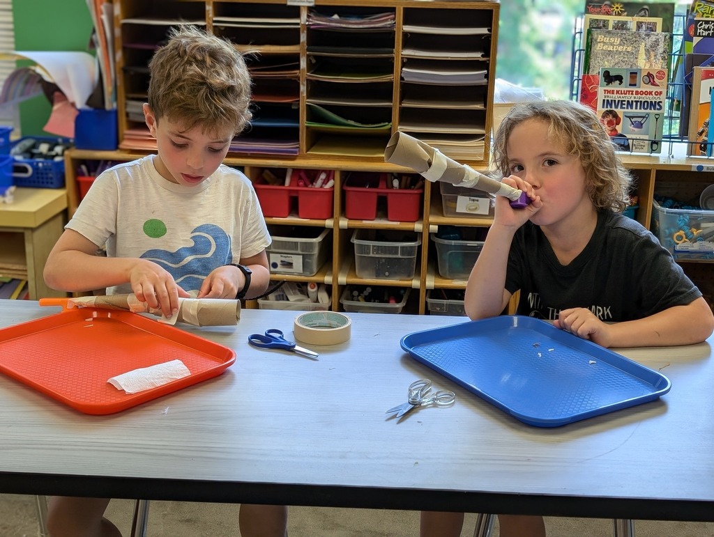 Two students building a cardboard shofar