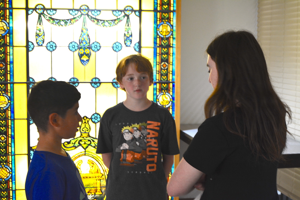 students and volunteer discuss