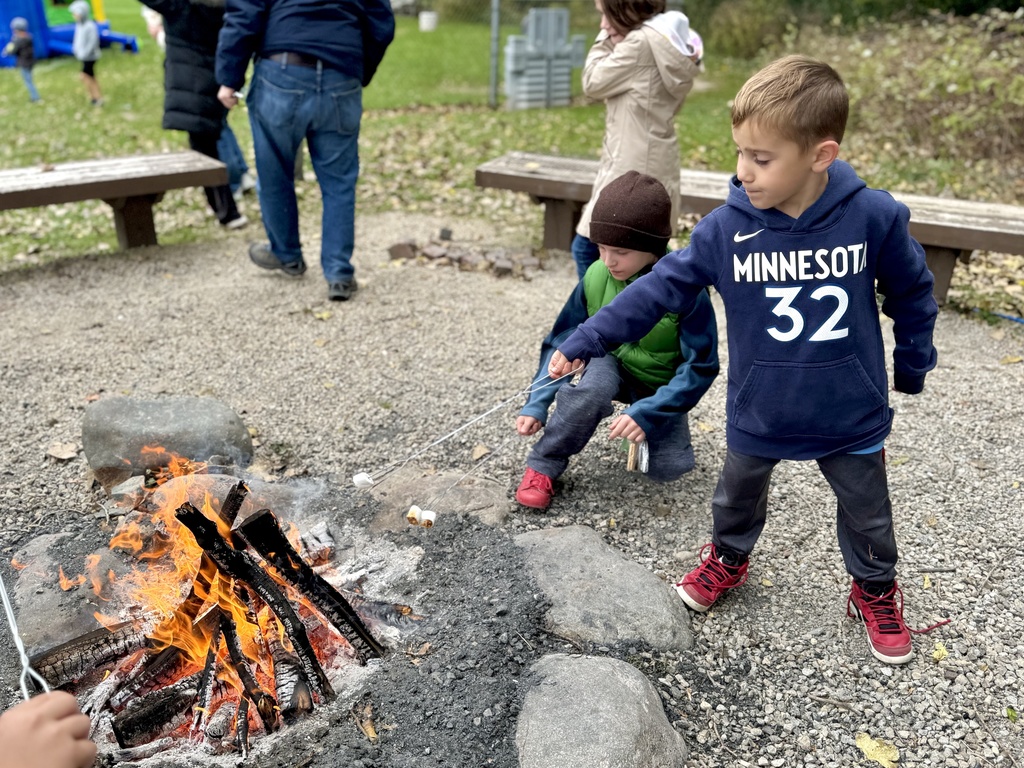 two Heilicher boys roast marshmallows