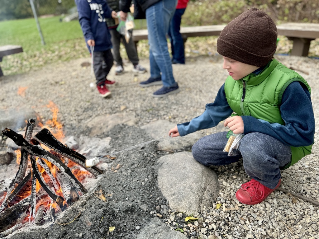 heilicher boy roasts marshmallows