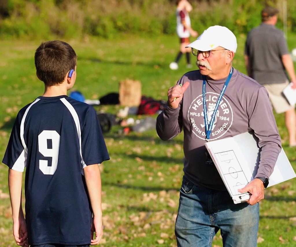 coach talks to heilicher player
