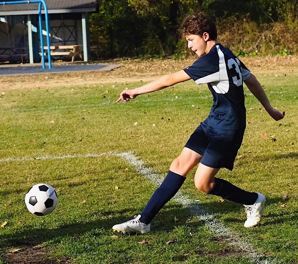 heilicher player kicks soccer ball
