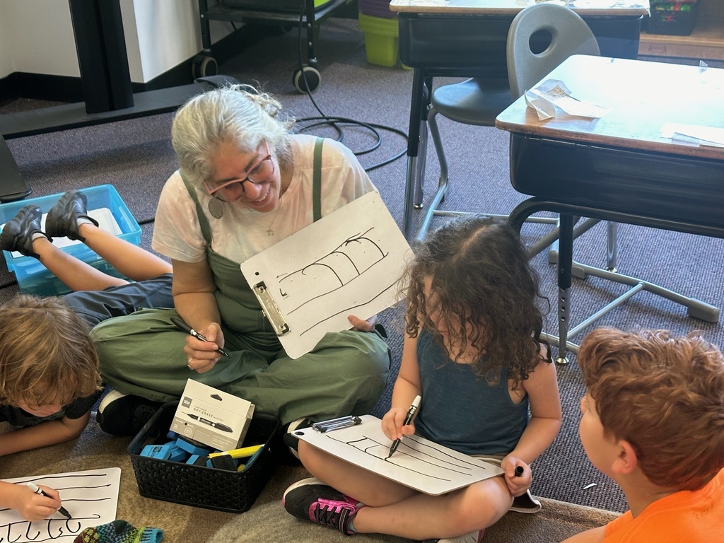 hamorah wendy and first grade students practice writing letter resh on white boards